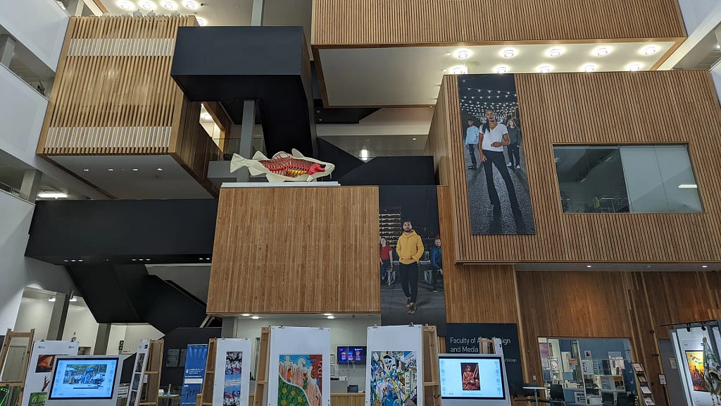Modern bronze-toned architectural atrium of a major UK higher education business faculty where Braddan provided numerous business analysis services,  reflecting Braddan's experience in enterprise-scale business analysis and consultancy